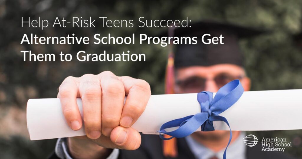 Graduating Student holding a rolled up diploma in front of him. Photo by Freepik.com