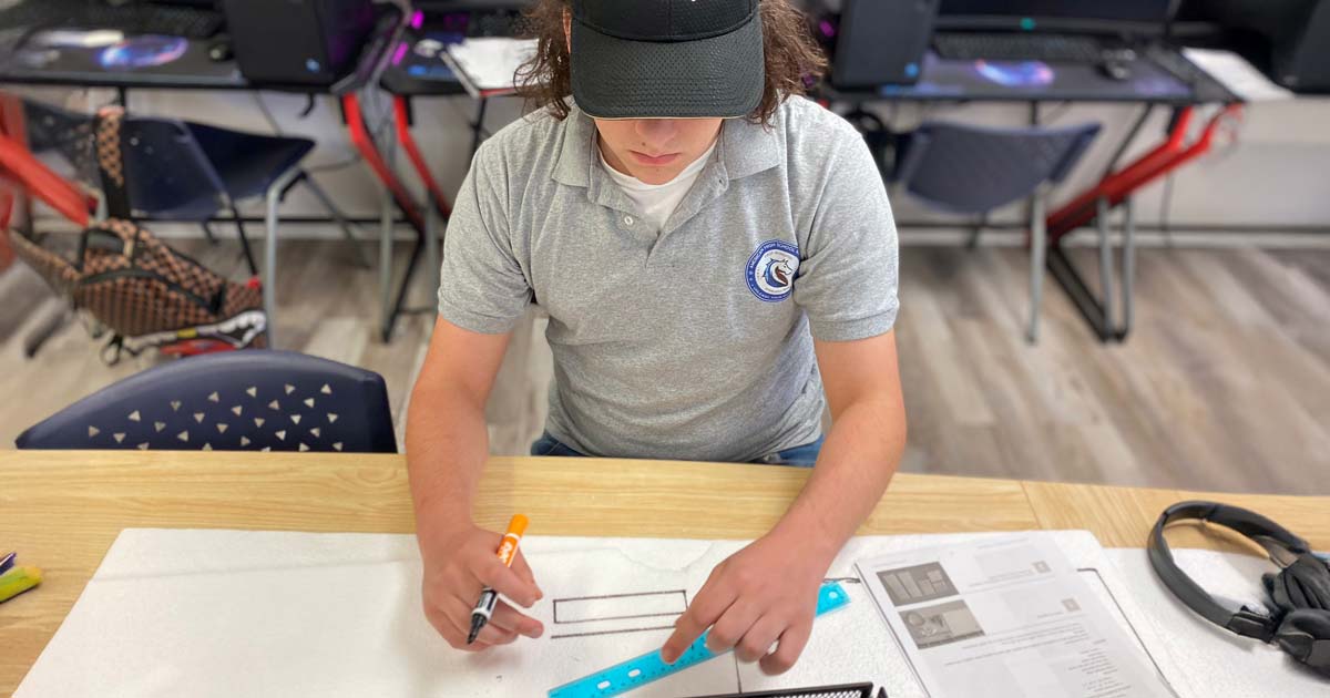 AHSA student working a project for his STEM Aviation program